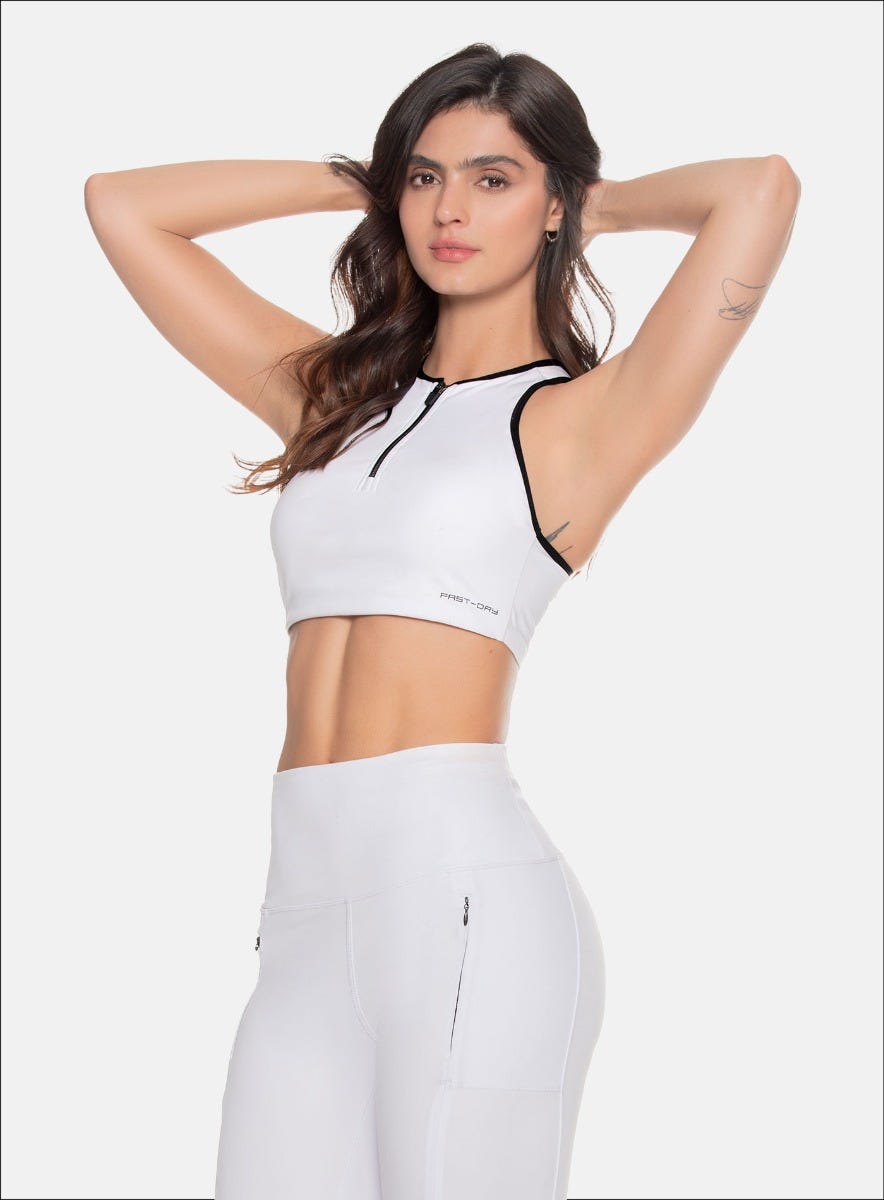 TOP DEPORTIVO DAMA CON CIERE DELANTEROSESGOS EN CONTRASTE EN SISAS Y CUELLO