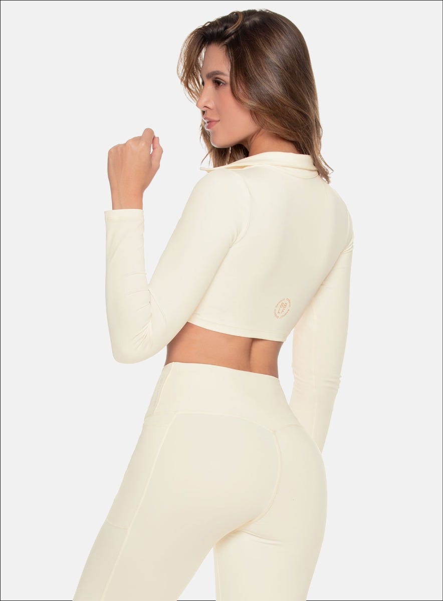Buzo deportivo color marfil para mujer, marca BABALÚ, referencia 109263, vista lateral. Compra al por mayor en int.babalu.com.co en USD.