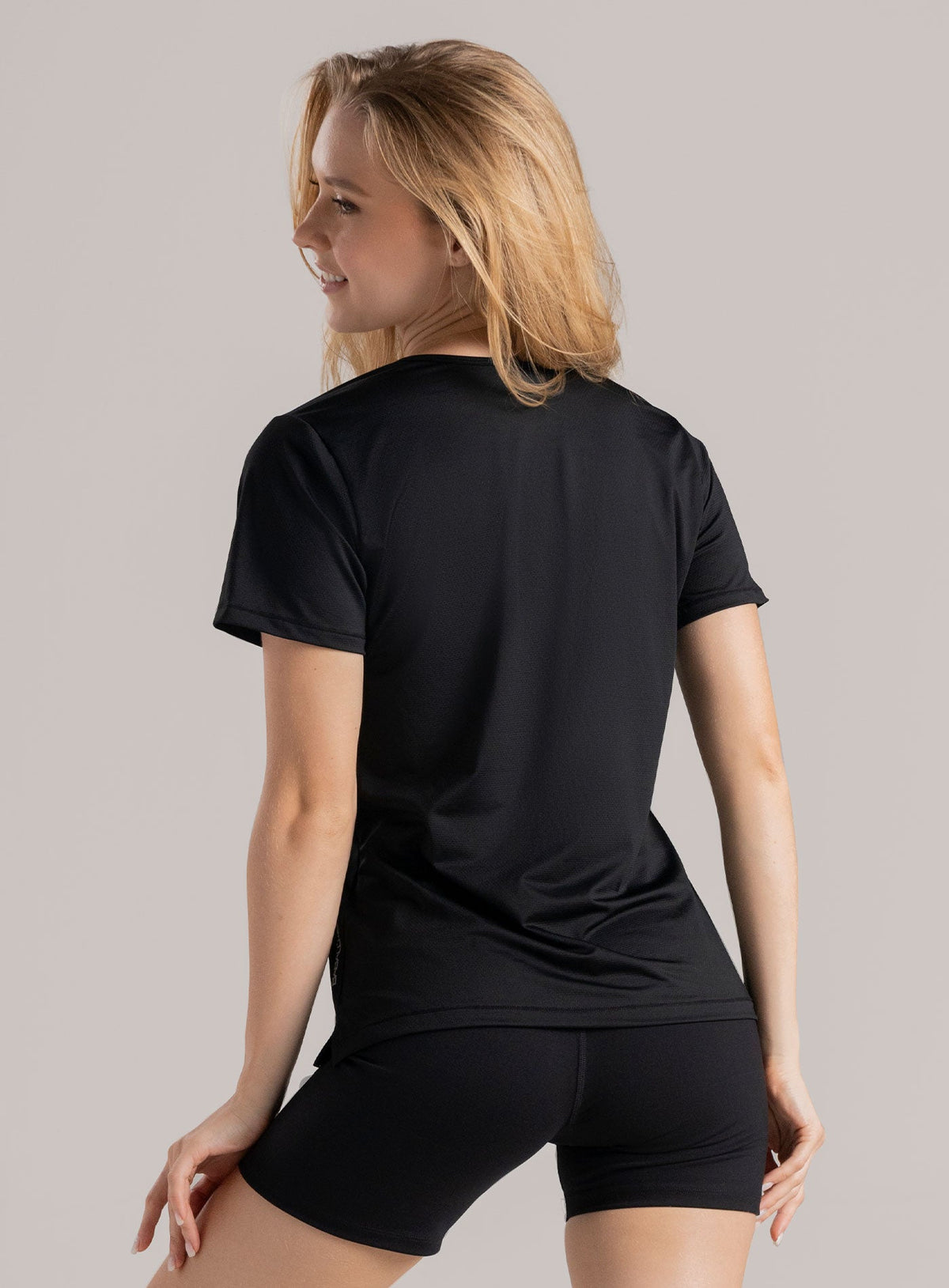 Camiseta deportiva color blanco para mujer, marca BABALÚ, referencia 114753, vista trasera. Compra al por mayor en int.babalu.com.co en USD.