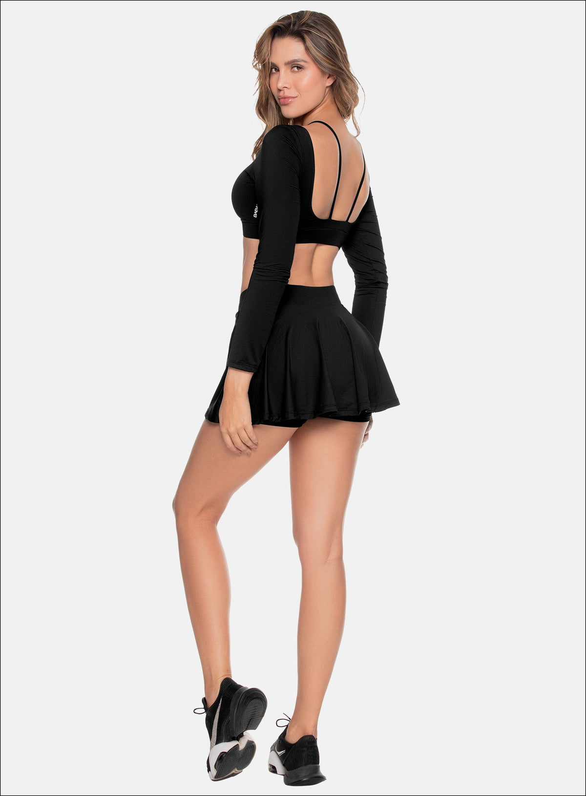 Falda deportiva color negro para mujer, marca BABALÚ, referencia 109343, vista trasera. Compra al por mayor en int.babalu.com.co en USD.