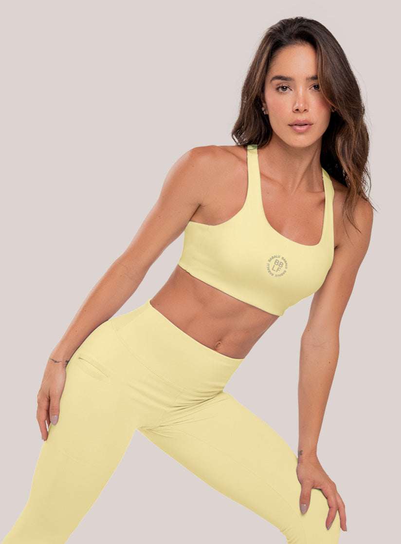 Top deportivo color amarillo para mujer, marca BABALÚ, referencia 111073, vista frontal. Compra al por mayor en int.babalu.com.co en USD.