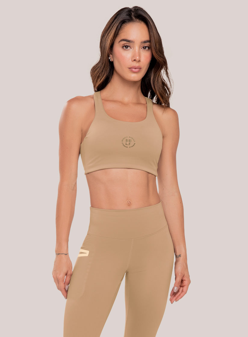 Top deportivo color beige para mujer, marca BABALÚ, referencia 111073, vista frontal. Compra al por mayor en int.babalu.com.co en USD.