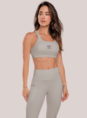 Top deportivo color gris para mujer, marca BABALÚ, referencia 111073, vista frontal. Compra al por mayor en int.babalu.com.co en USD.