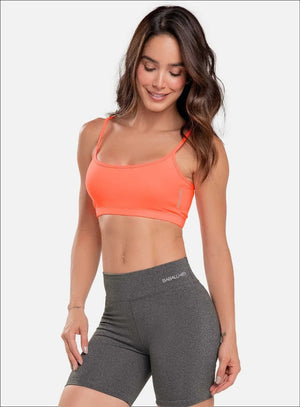 Top deportivo color naranja para mujer, marca BABALÚ, referencia 15943, vista frontal. Compra al por mayor en int.babalu.com.co en USD.